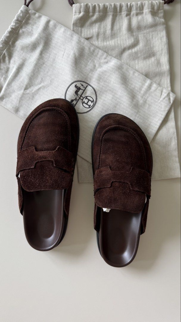 Hermes Brown Suede Mules with Dust Bags (Category: Sneakers & Footwear) located in Singapore. Submitted by thtaisi (Listing ID 1440835455, Image 1). Description: - Authentic Hermes brown suede mules - redone at Cobbler Village to recolour the suede for 300sgd. - Comes with original dust bags - Classic, easy slip-on design - Soles feature the iconic Hermes logo - Ideal for casual everyday wear.