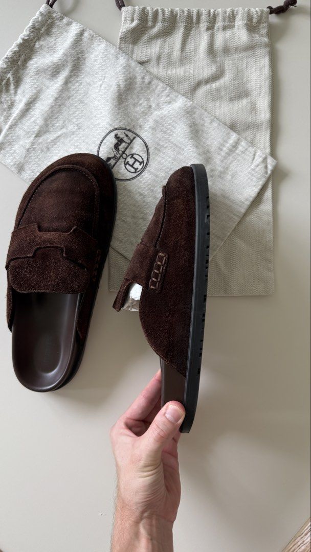 Hermes Brown Suede Mules with Dust Bags (Category: Sneakers & Footwear) located in Singapore. Submitted by thtaisi (Listing ID 1440835455, Image 2). Description: - Authentic Hermes brown suede mules - redone at Cobbler Village to recolour the suede for 300sgd. - Comes with original dust bags - Classic, easy slip-on design - Soles feature the iconic Hermes logo - Ideal for casual everyday wear.