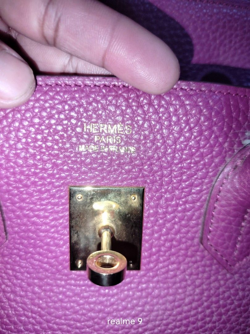 Hermes Paris Birkin Style Handbag (Category: Luxury Bags & Wallets) located in Cebu City. Submitted by tlisurplus (Listing ID 1440899266, Image 2). Description: - Stunning magenta Birkin-style handbag - Textured leather exterior - Elegant gold hardware - Includes lock and key - Dust bag provided (as shown in photos) - Versatile for everyday or special events.