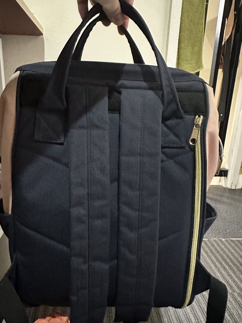 Authentic Himawari Backpack Navy Blue & Pink (Category: Backpacks) located in Caloocan City. Submitted by andreya87 (Listing ID 1440785163, Image 3). Description: - Himawari backpack with a stylish navy blue and pink two-tone canvas design. - Features multiple compartments inside for excellent organization. - Convenient side pockets, perfect for water bottles. - Comfortable padded straps for easy carrying. - All zippers are in smooth working cond