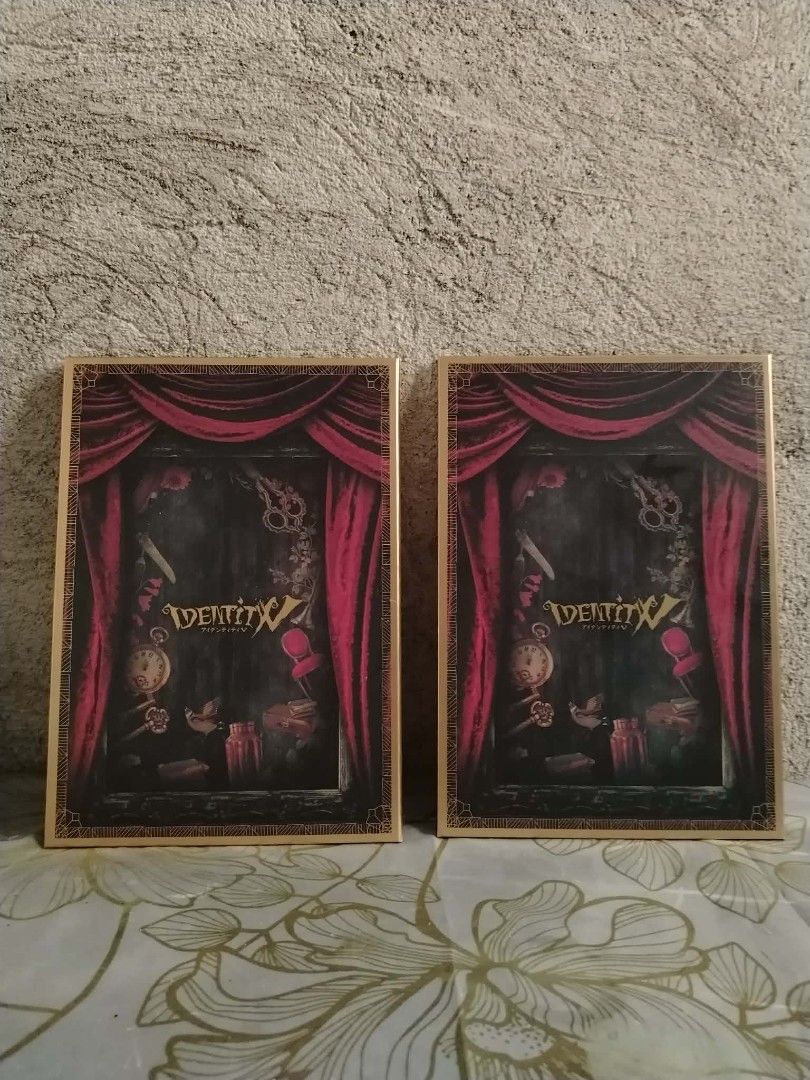 Identity V Game Merchandise - Set of 2 (Category: Character Goods) located in San Fernando. Submitted by purehustlin (Listing ID 1440806493, Image 1). Description: - Set of 2 Identity V game merchandise - Features iconic game logo and artwork - Unique red curtain design on the back - Ideal for fans and collectors of Identity V.