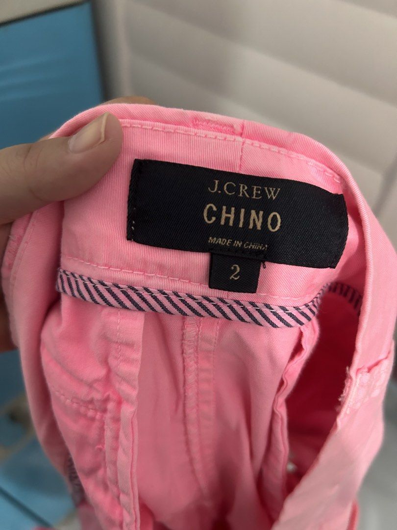 J. Crew Pink Chino Shorts Size 2 (Category: Shorts) located in Makati City. Submitted by candybluex (Listing ID 1440909454, Image 1). Description: Pink J. Crew chino shorts. Size 2. Has a zip fly with button closure. There are a couple of small marks on the front, as pictured. Can be cleaned off. Great for casual wear..