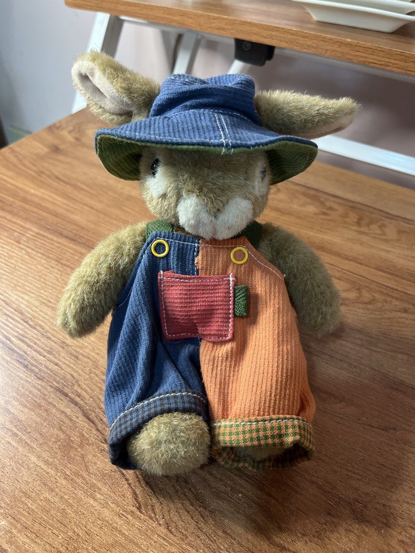 Japan Cute Bunny Plush Toy in Overalls and Hat (Category: Toys & Games) located in Gapan. Submitted by lunashop14 (Listing ID 1440807928, Image 1). Description: - Adorable bunny plush toy - Features a blue hat with a green brim - Wears colorful patchwork overalls (blue & orange corduroy) - Overalls have a cute red pocket detail - Ideal for collectors or as a charming gift.