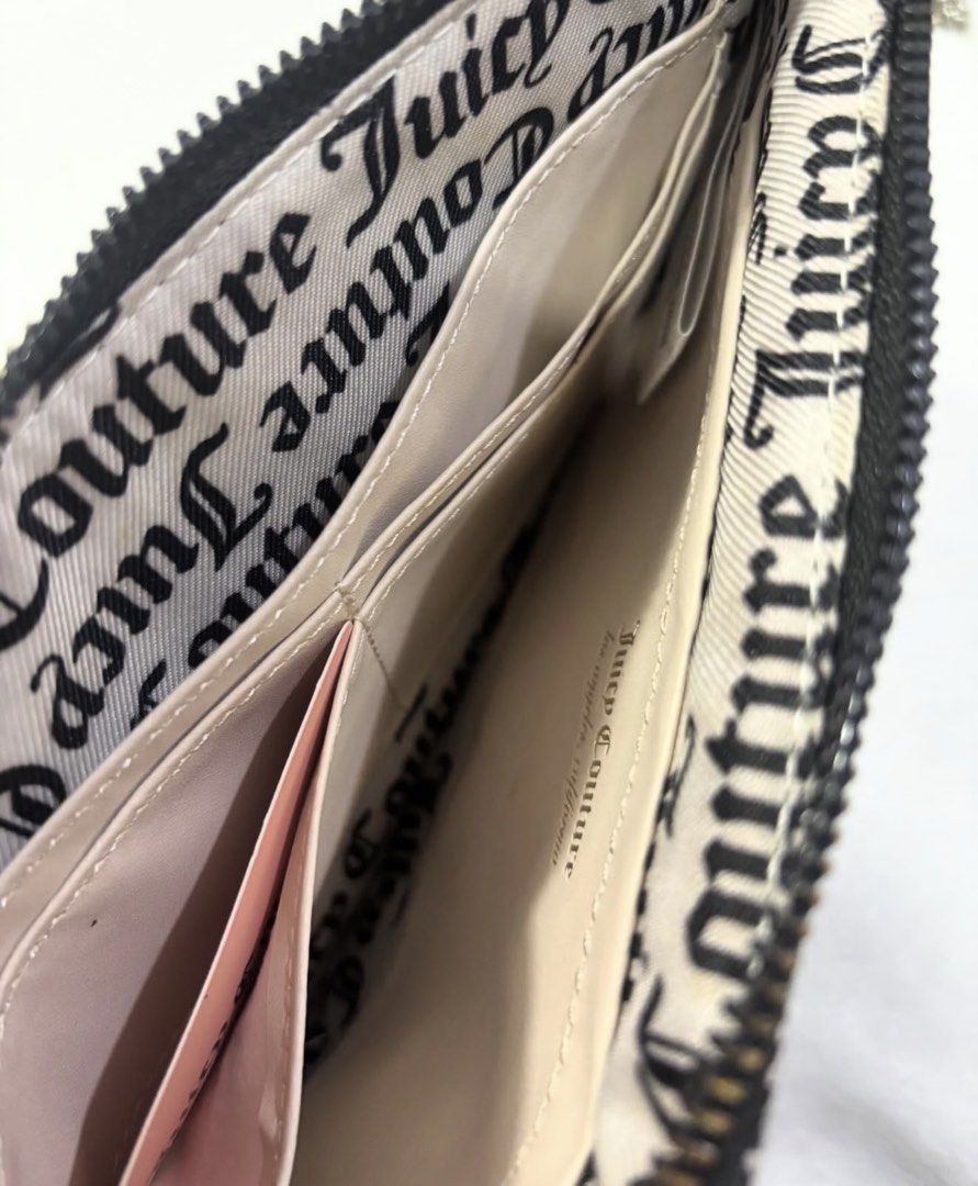 Juicy Couture Pouch Wristlet Black Grey Monogram (Category: Purses & Pouches) located in Mandaluyong City. Submitted by isydln (Listing ID 1440822495, Image 2). Description: - Authentic Juicy Couture wristlet pouch - Classic black and grey monogram print - Features a black oval patch with gold heart details and Juicy Couture logo - Secure zipper closure - Multiple card slots inside for organization - Comes with original tag, brand new.