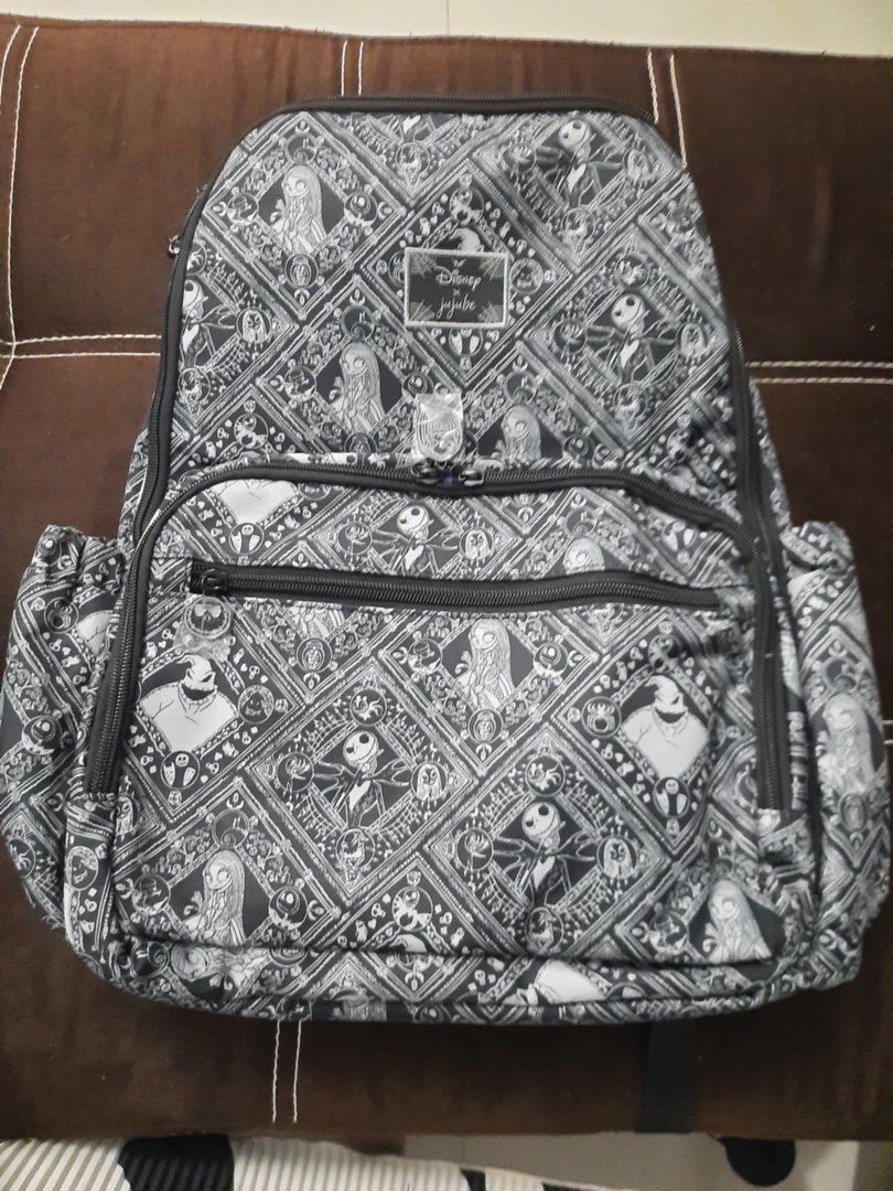 Ju-Ju-Be Disney The Nightmare Before Christmas Backpack (Category: Backpacks) located in Dagupan City. Submitted by francesco11 (Listing ID 1440768425, Image 1). Description: - Authentic Ju-Ju-Be backpack - The Nightmare Before Christmas collection - All-over black and white Jack Skellington print - Multiple interior pockets for organization - Side pockets for extra storage - Vibrant purple lining with yellow snake print - Secure zipper closures.
