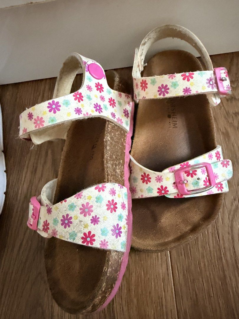 Kids Floral Cork Sandals with Pink Buckles (Category: Babies & Kids Fashion) located in Paranaque City. Submitted by msl_crux26 (Listing ID 1440824056, Image 2). Description: - Adorable white sandals with vibrant floral print straps. - Secure and adjustable pink buckles. - Comfortable cork footbed for all-day wear. - Ideal for summer adventures. - Shows slight signs of wear on footbed and straps. - size 28.