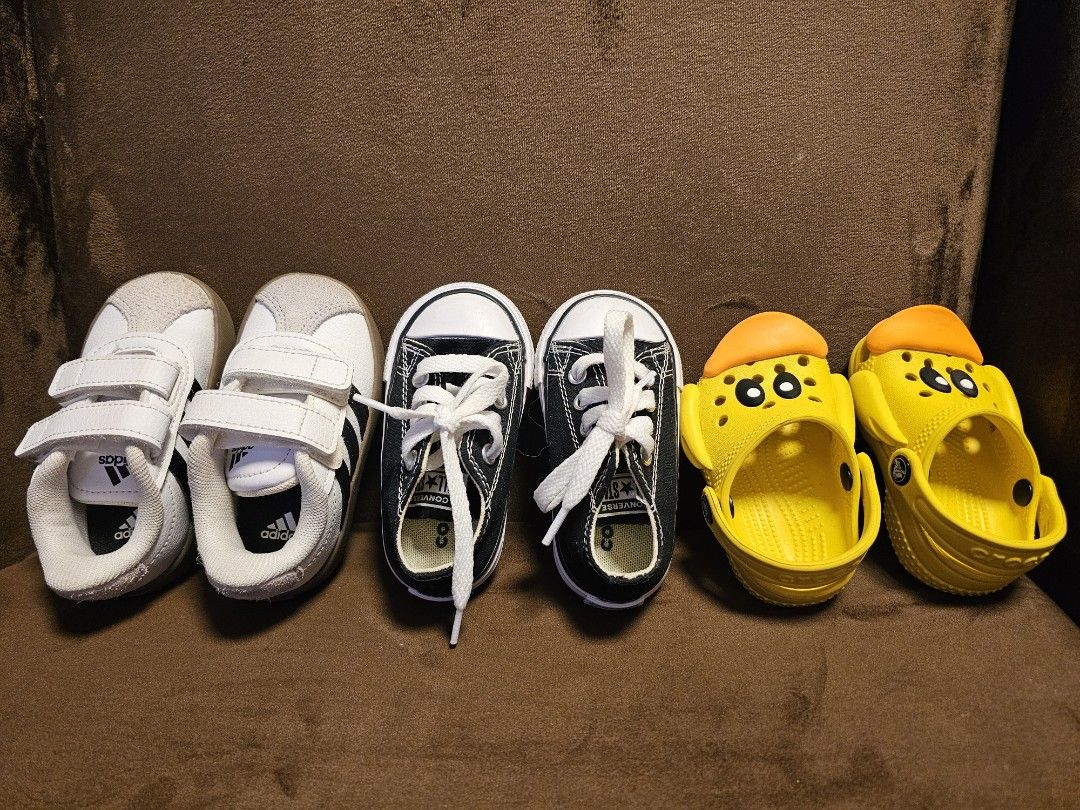 Kids Shoes Bundle: Adidas, Converse, Crocs - Various Sizes (Category: Babies & Kids Fashion) located in San Mateo. Submitted by authenticitemshere (Listing ID 1440809801, Image 3). Description: All bought in Canada. With box except for the crocs. - Bundle of 3 pairs of kids' shoes - White Adidas sneakers with velcro straps - Black Converse high-tops with white laces - Yellow duck-themed Crocs clogs - Great for playtime and everyday wear.