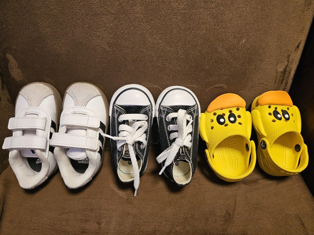 Kids Shoes Bundle: Adidas, Converse, Crocs - Various Sizes (Category: Babies & Kids Fashion) located in San Mateo. Submitted by authenticitemshere (Listing ID 1440809801, Image 2). Description: All bought in Canada. With box except for the crocs. - Bundle of 3 pairs of kids' shoes - White Adidas sneakers with velcro straps - Black Converse high-tops with white laces - Yellow duck-themed Crocs clogs - Great for playtime and everyday wear.