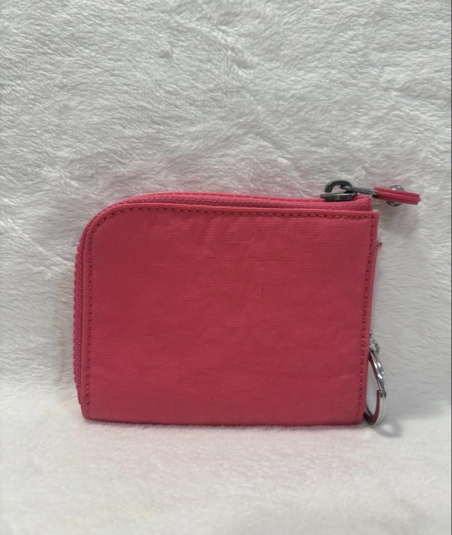 Kipling Pink Nylon Coin Purse with Keychain (Category: Wallets & Card holders) located in Mandaluyong City. Submitted by isydln (Listing ID 1440822659, Image 2). Description: - Cute pink Kipling coin purse - Made from durable nylon material - Features a zippered main compartment - Includes a front slip pocket - Comes with a keychain attachment - Ideal for organizing coins, cards, or small essentials - Compact and easy to carry.