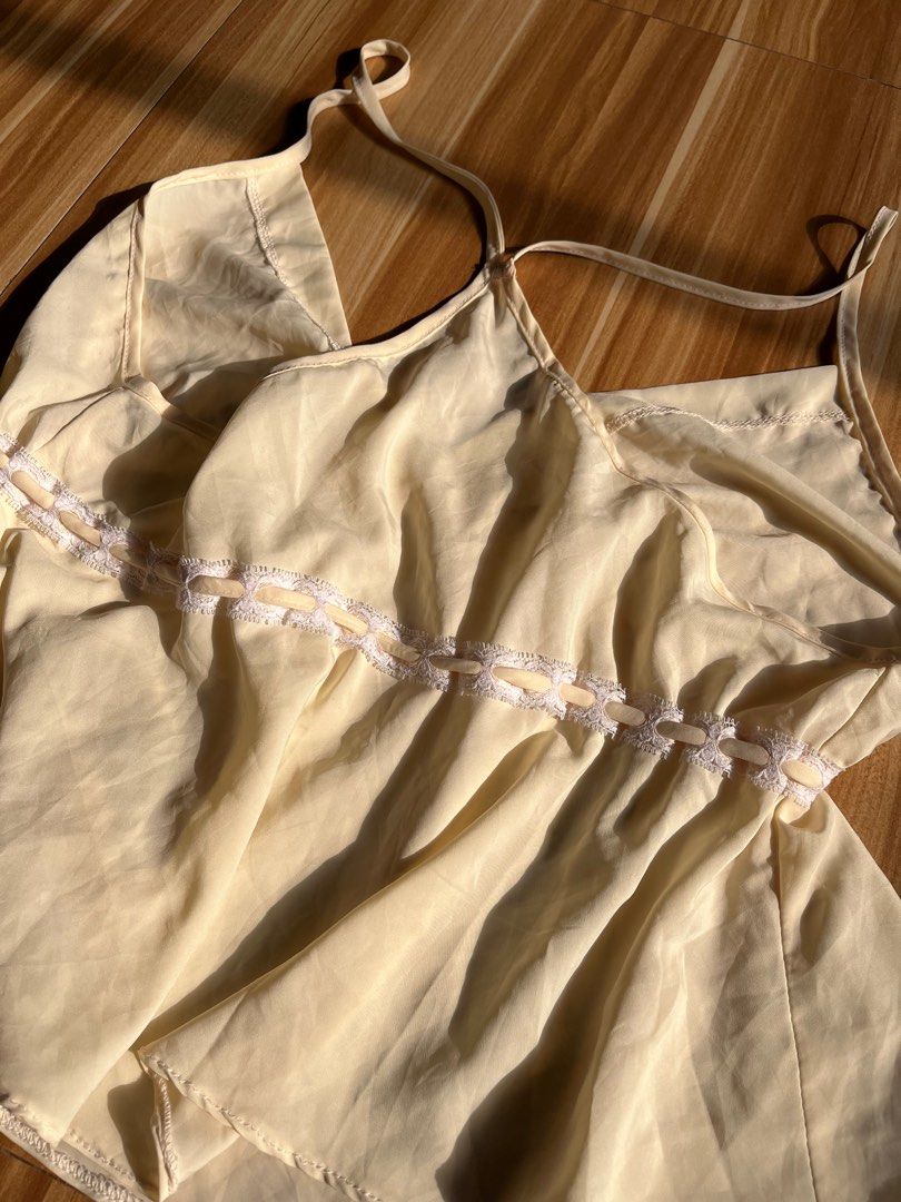 Lace Cami Top (Category: Sleeveless) located in Los Banos. Submitted by claulim (Listing ID 1440759409, Image 3). Description: Cute pastel yellow top. Tags: coquette, babydoll top, vintage camisole, dainty, fairycore, Y2K aesthetic, milkmaid top.