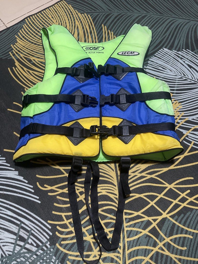 LE CAF SPORT Life Vest Jacket (Category: Vests) located in Davao. Submitted by rcgulanes.moon (Listing ID 1440896269, Image 2). Description: - LE CAF SPORT life vest - Vibrant colors: Bright lime green, blue, and yellow - Multiple adjustable straps with buckles for a secure and customizable fit - Perfect for water sports and boating activities - Ensures safety on the water.