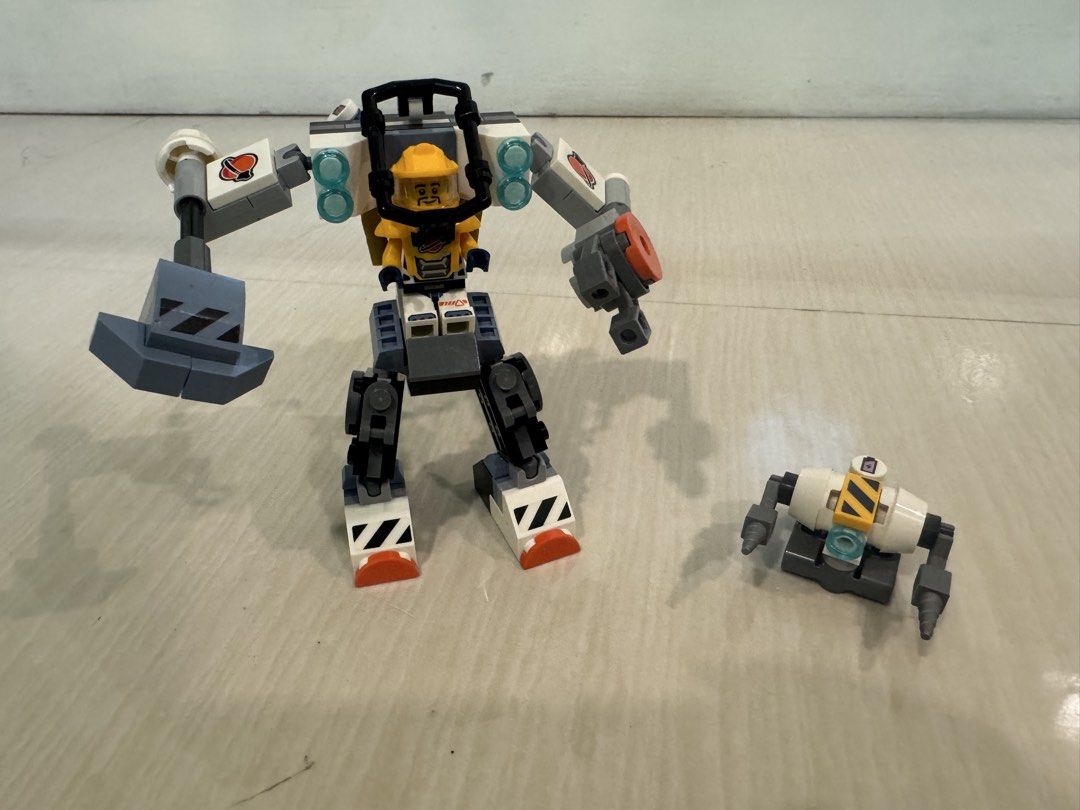 LEGO City Space Construction Mech (Category: Toys & Games) located in Malolos. Submitted by wright.ricky (Listing ID 1440810226, Image 1). Description: Selling As is LEGO mech set with pilot figure and small drone. - Features articulated arms and legs for dynamic posing. - Pilot comes in a bright yellow suit and helmet. - Drone includes drill attachments for extra play features. - All pieces appear to be present. - Ideal for building and imaginat