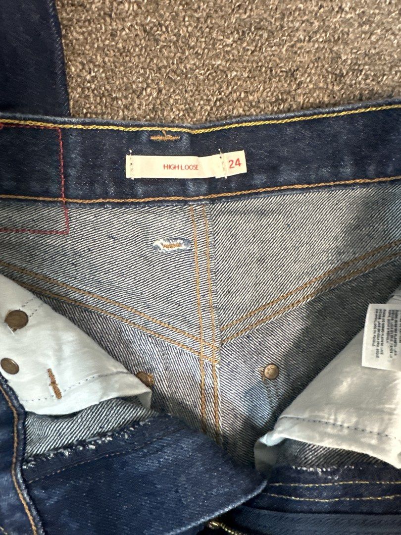 Levi's Red High Loose Jeans Size 24 (Category: Jeans) located in Mandaluyong City. Submitted by krstls (Listing ID 1440819399, Image 2). Description: - Dark wash Levi's jeans - High waist, loose fit - Size 24 - Light stain on lower leg (visible in last photo).