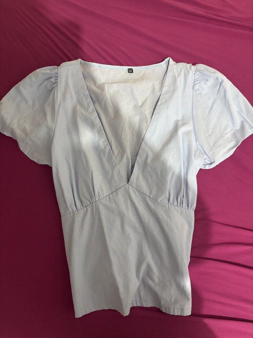 Light Blue V-Neck Puff Sleeve Top with Tie Back (Category: Blouses) located in Manila. Submitted by prelovedbykylieeeec (Listing ID 1440940998, Image 1). Description: Size XL-2XL never used.
