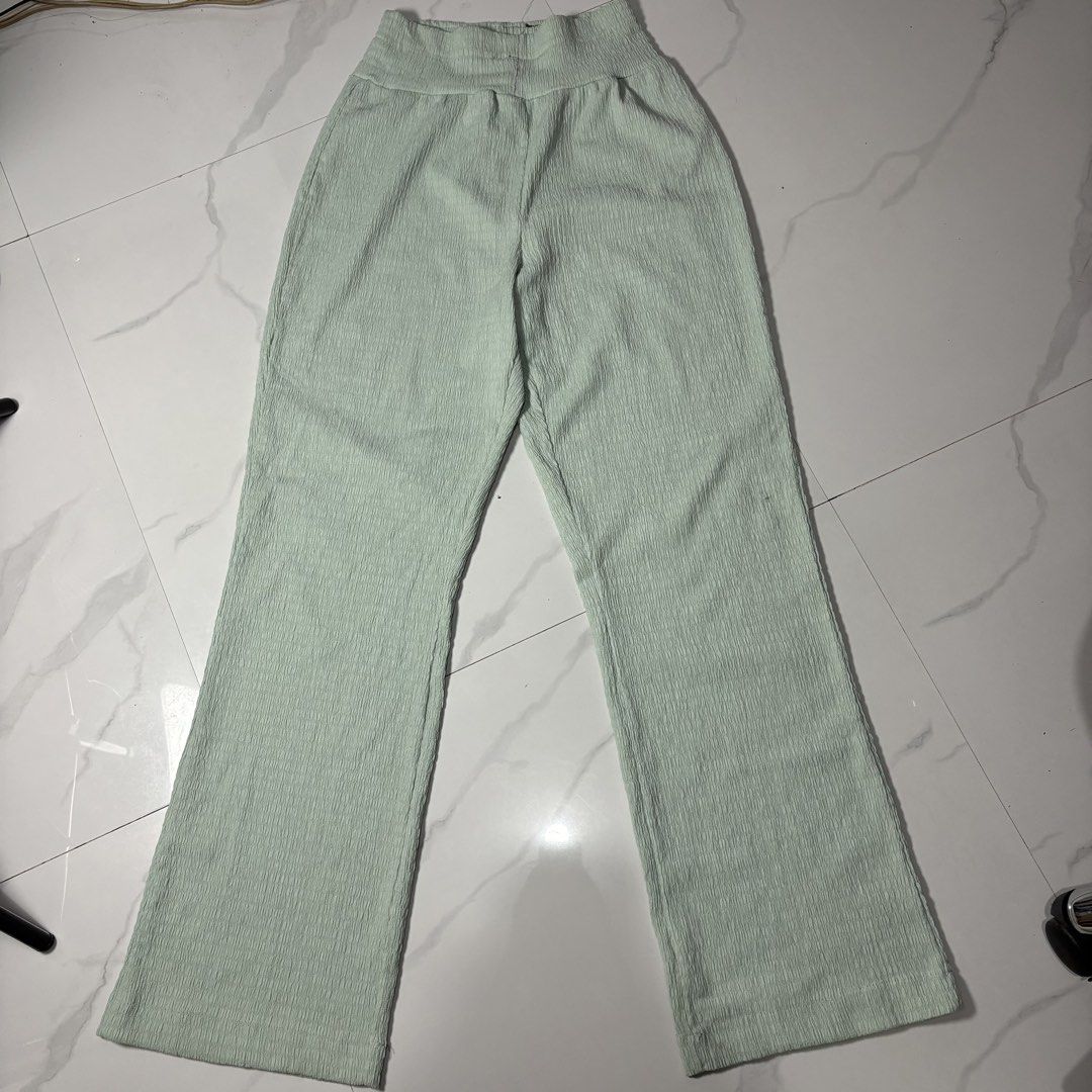 Light Green Textured High-Waisted Flare Pants (Category: Other Bottoms) located in Magalang. Submitted by dclutter_ki (Listing ID 1440934249, Image 1). Description: REPRICED (150 b4) Waist: 22-32 Length: 41 Pm me for more pics and questions. MOP: GCash/Maribank/Maya Light green pants with a textured fabric. High-waisted design with a comfortable elastic waistband. Flare leg silhouette. Great for casual wear or dressing up..