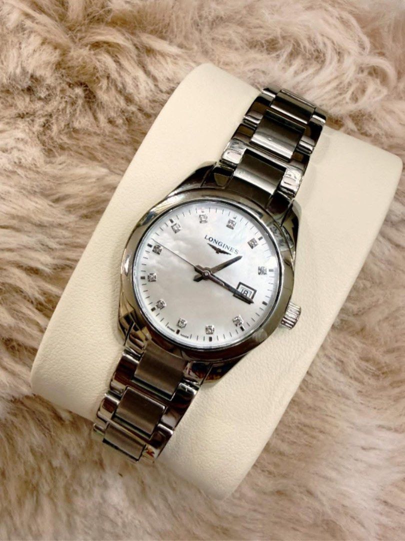 Longines Watch (Category: Luxury Watches) located in Quezon City. Submitted by liezl.marie (Listing ID 1440849396, Image 3). Description: L0ng!nes Conquest Classic stainless steel ladies’ watch with a white mother-of-pearl dial and diamond markers. 39,800 Open for layaway. Disclaimer: We are not affiliated, associated, authorized, endorsed by or in any way officially connected with any other company or luxury brand. All copyrights are reserved to
