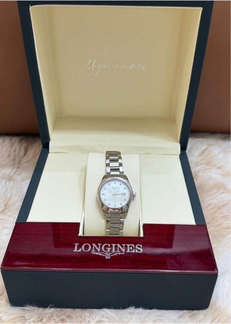 Longines Watch (Category: Luxury Watches) located in Quezon City. Submitted by liezl.marie (Listing ID 1440849396, Image 2). Description: L0ng!nes Conquest Classic stainless steel ladies’ watch with a white mother-of-pearl dial and diamond markers. 39,800 Open for layaway. Disclaimer: We are not affiliated, associated, authorized, endorsed by or in any way officially connected with any other company or luxury brand. All copyrights are reserved to