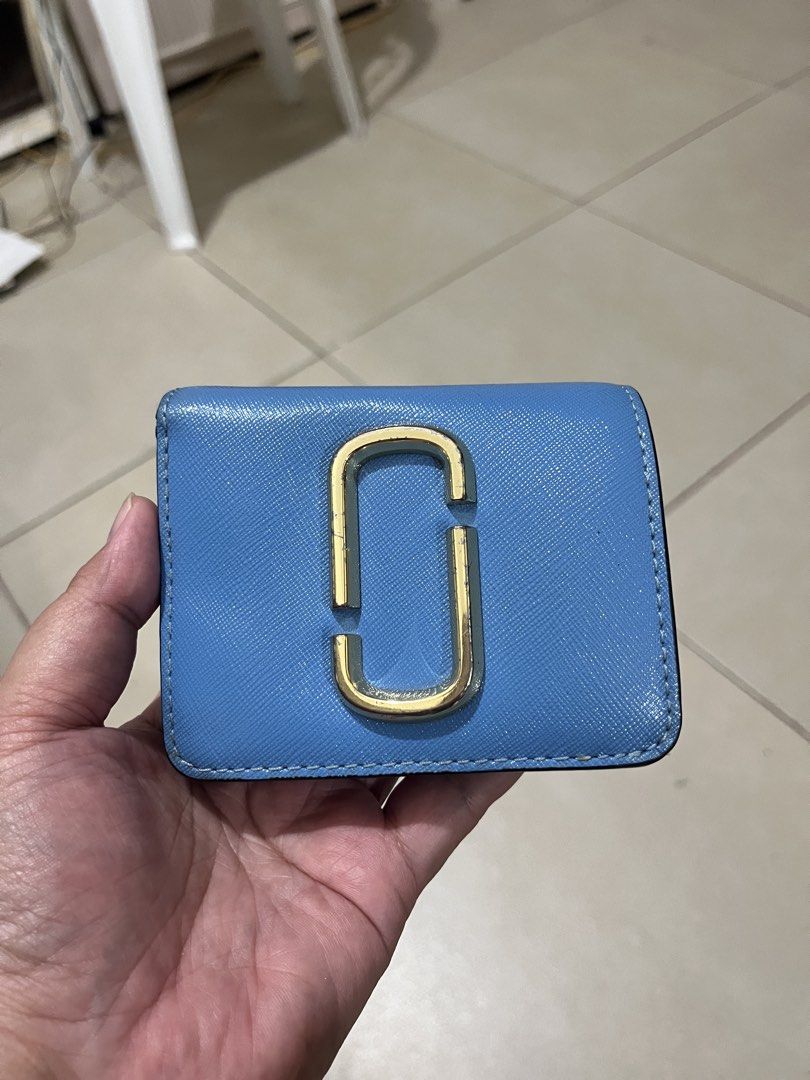 Marc Jacobs Snapshot Compact Wallet Blue (Category: Luxury Bags & Wallets) located in Quezon City. Submitted by yumiizashop (Listing ID 1440910413, Image 1). Description: - Brand: Marc Jacobs - Color: Blue exterior, bright yellow interior - Features: Zip compartment, card slots - Hardware: Gold - Size: Small and compact, fits easily in pockets/small bags - Ideal for: Carrying essentials on the go.