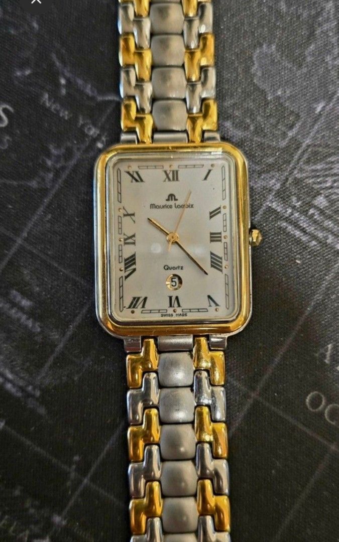 Authentic Maurice Lacroix Quartz Two-Tone Rectangle Watch (Category: Luxury Watches) located in Quezon City. Submitted by satisfied100 (Listing ID 1440874099, Image 3). Description: - Maurice Lacroix Swiss Made Watch -fully functional - Elegant white dial with Roman numeral hour markers - Convenient date window at the 6 o'clock position - Stylish two-tone stainless steel bracelet - Reliable quartz movement price php 10,490.