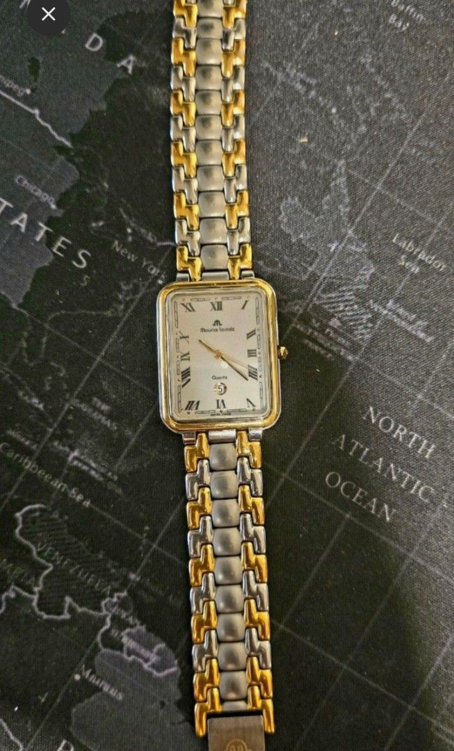 Authentic Maurice Lacroix Quartz Two-Tone Rectangle Watch (Category: Luxury Watches) located in Quezon City. Submitted by satisfied100 (Listing ID 1440874099, Image 2). Description: - Maurice Lacroix Swiss Made Watch -fully functional - Elegant white dial with Roman numeral hour markers - Convenient date window at the 6 o'clock position - Stylish two-tone stainless steel bracelet - Reliable quartz movement price php 10,490.