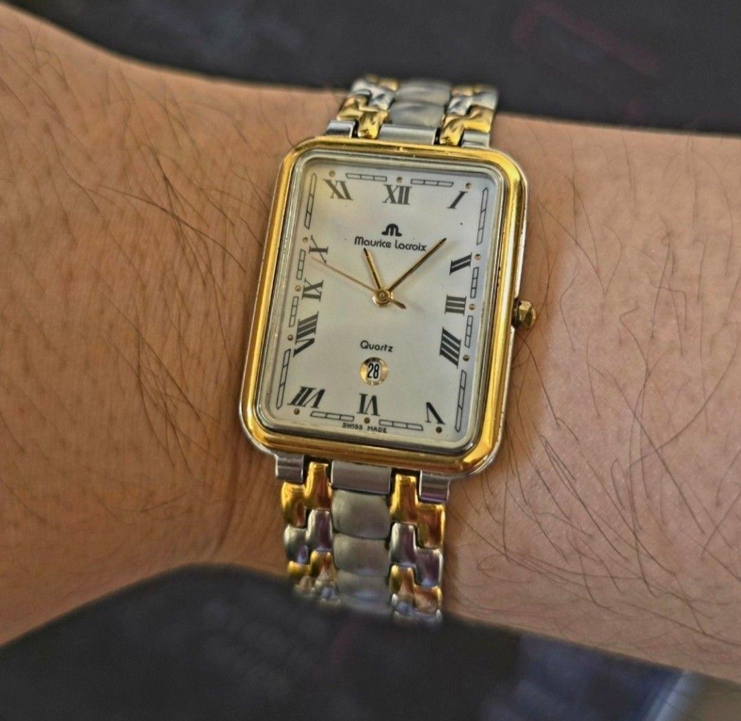 Authentic Maurice Lacroix Quartz Two-Tone Rectangle Watch (Category: Luxury Watches) located in Quezon City. Submitted by satisfied100 (Listing ID 1440874099, Image 1). Description: - Maurice Lacroix Swiss Made Watch -fully functional - Elegant white dial with Roman numeral hour markers - Convenient date window at the 6 o'clock position - Stylish two-tone stainless steel bracelet - Reliable quartz movement price php 10,490.