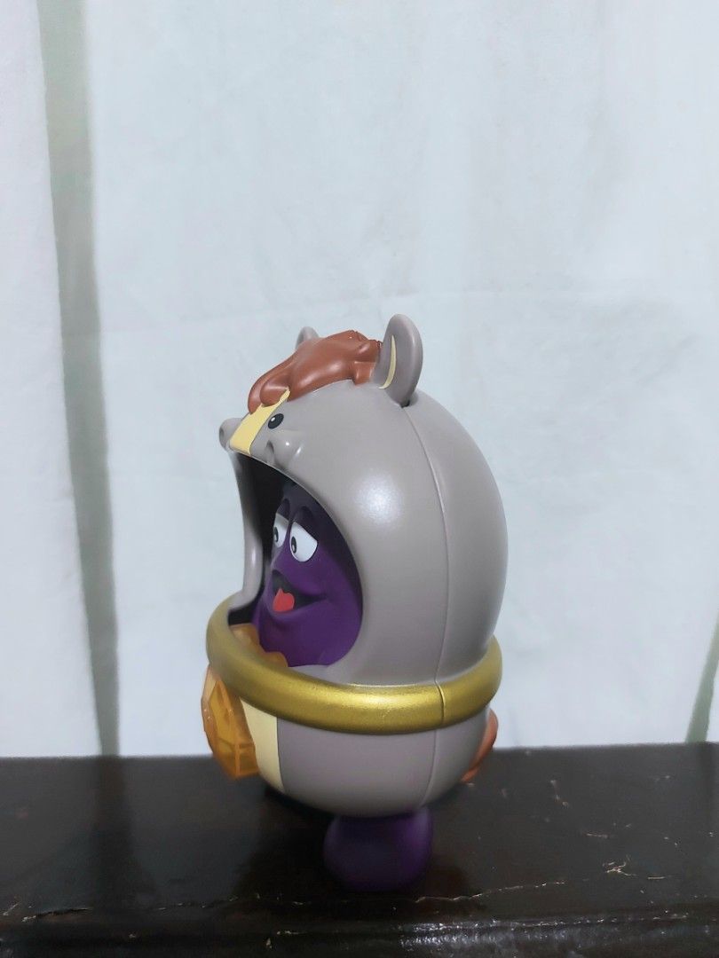 McDonald's Grimace Toy in Horse Costume (Category: Character Goods) located in Manila. Submitted by nicolezald25729 (Listing ID 1440896607, Image 2). Description: - McDonald's Grimace Chineze Zodiac Happy Meal collectible toy. - Grimace is dressed in a charming horse costume. - Features Grimace's iconic purple color and happy expression. - Costume is grey with detailed horse ears and mane. - Includes a stylish gold band around the middle. - McDon