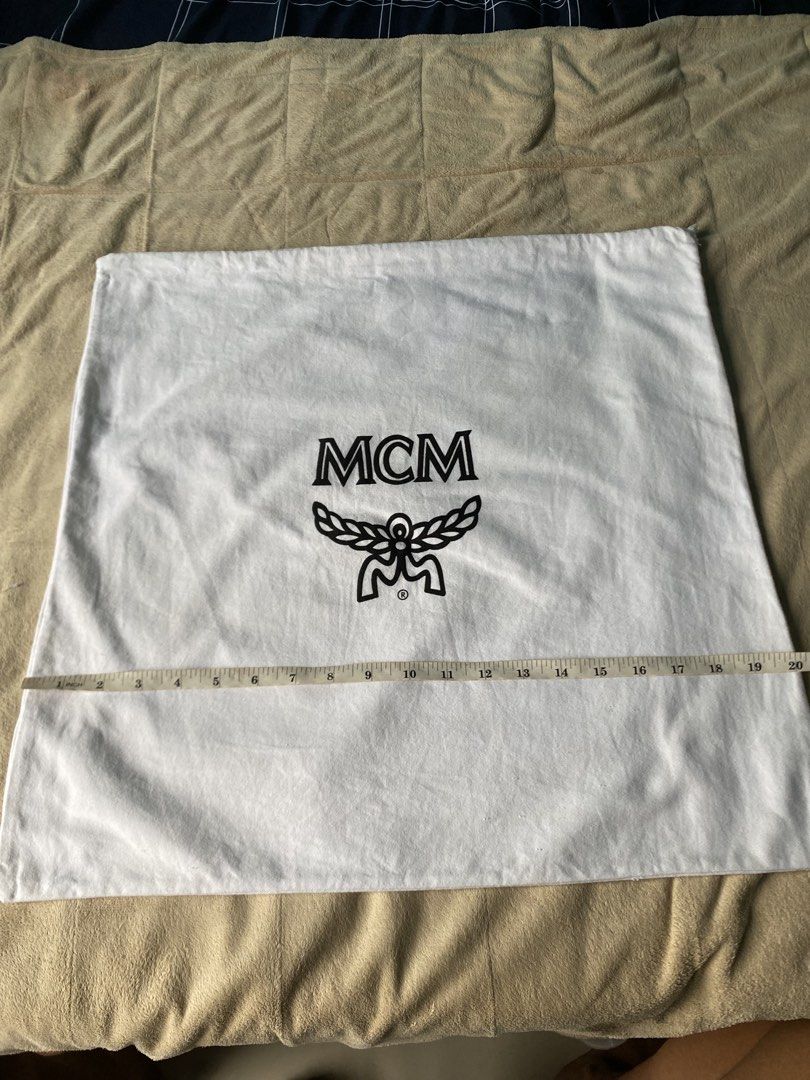 MCM Dust Bag (Category: Luxury Bags & Wallets) located in Cebu City. Submitted by nardcen (Listing ID 1440791327, Image 2). Description: - Authentic MCM dust bag - Features iconic MCM logo - Dimensions: Approximately 20 inches x 18 inches - Perfect for storing handbags, shoes, or other valuables.