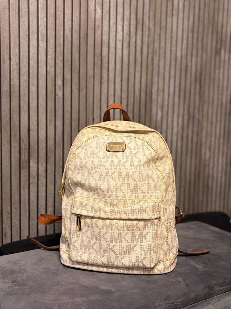 Michael Kors Signature Logo Backpack (Category: Backpacks) located in Rizal. Submitted by bingbong21 (Listing ID 1440914730, Image 1). Description: - Classic Michael Kors backpack - Signature MK logo pattern all over - Tan leather trim and straps - Front zip pocket for easy access - Top handle and adjustable shoulder straps - Great everyday bag -shipping via lalamove/J&T c/o buyer.