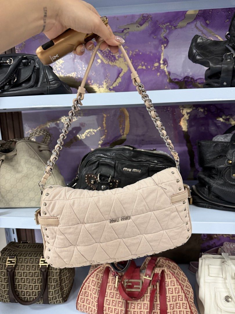 Miu Miu Quilted Chain Shoulder Bag (Category: Luxury Bags & Wallets) located in Cainta. Submitted by bagsfromdara (Listing ID 1440940668, Image 2). Description: - Light pink Miu Miu shoulder bag - Quilted design with all-over stud details - Silver chain strap with leather accents - Unique crystal and silver clasp closure - Spacious interior - Versatile for everyday use or evening events.
