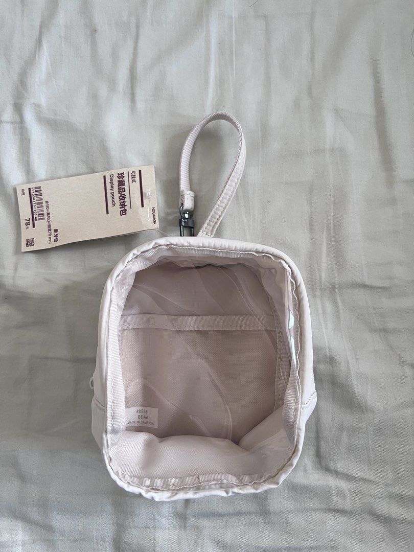 MUJI display pouch (Category: Purses & Pouches) located in Makati City. Submitted by v_nav (Listing ID 1440835033, Image 1). Description: Keep your essentials organised and easy to find. Clip it to your bag or hang it up for convenience. Dimension Approx. 110mm W x 160mm H x 70mm D White.