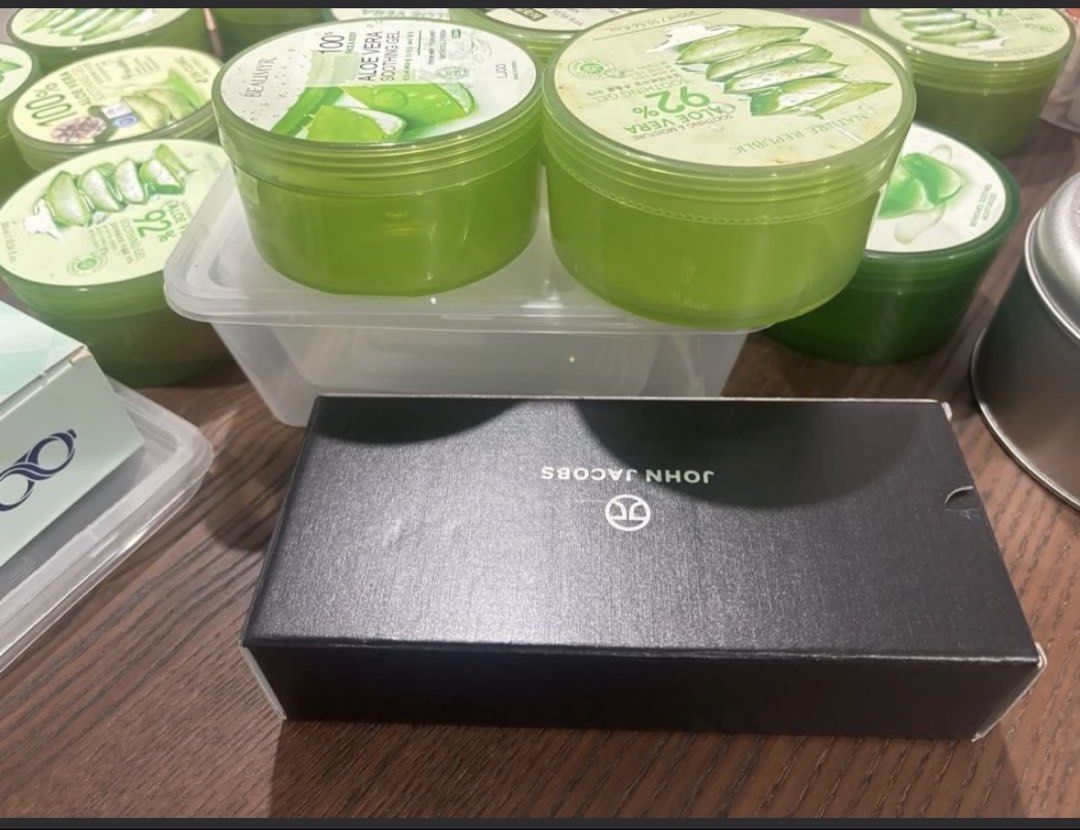 Empty containers (Category: Face Care) located in Singapore. Submitted by jodiestrawberry (Listing ID 1440873722, Image 3). Description: - Bundle includes Nature Republic Aloe Vera 92% Soothing Gels. - Also includes assorted skincare items: Dove products, G-Shock watch tin, John Jacobs box. - Condition varies: some items are full, others are partially used. - Ideal for replenishing your supply of the popular Aloe Vera Soothing Gel. - Great value 