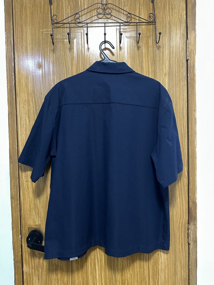 Navy Blue Short Sleeve Button Up Shirt (Category: Tshirts & Polo Shirts ) located in Quezon City. Submitted by munozla31 (Listing ID 1440844694, Image 2). Description: - Boxy Fit - Size Large (23W x 27.5L) - Like New.