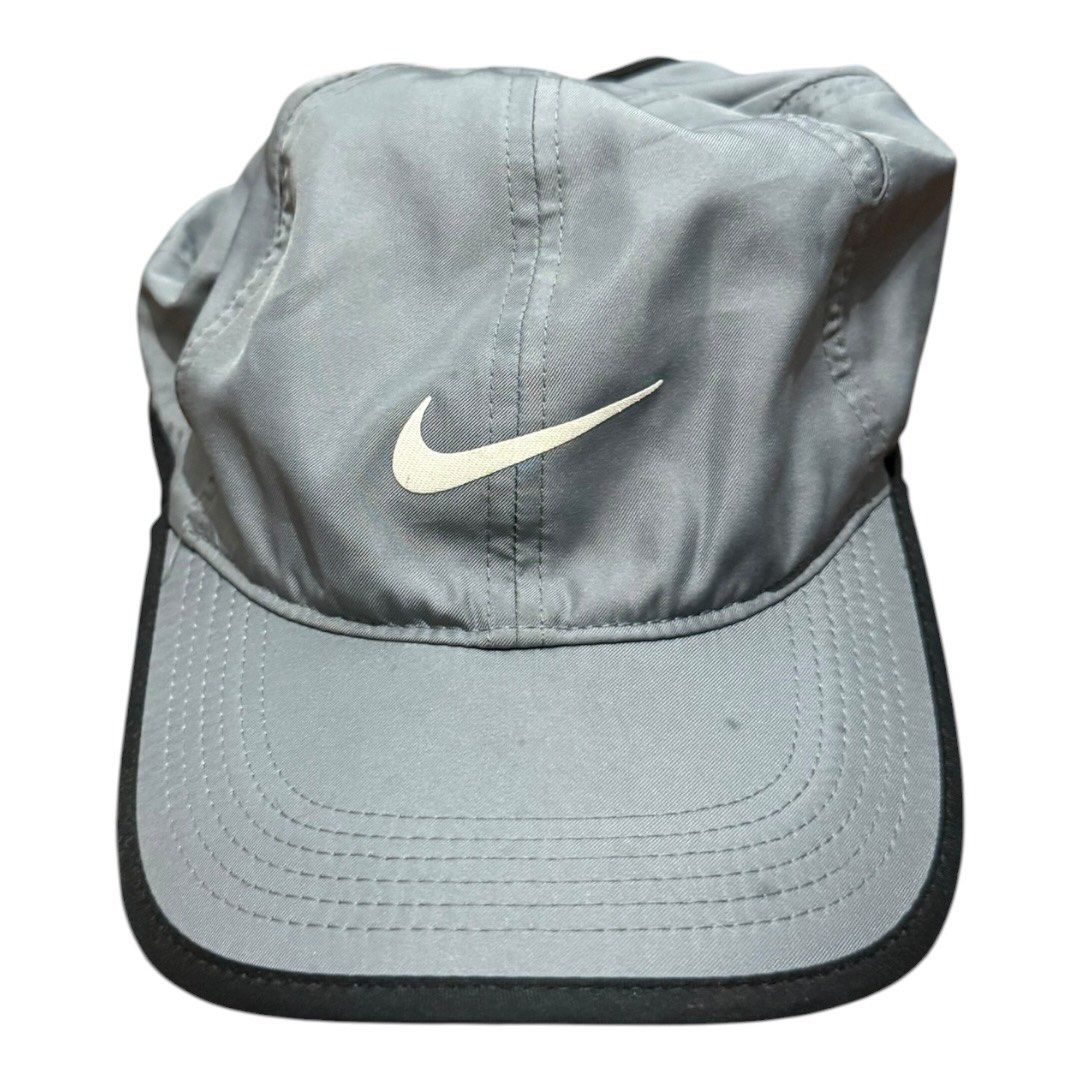 Nike Featherlight Dri-FIT Performance Cap Grey Adjustable Sports Hat (Category: Caps & Hats) located in Paranaque City. Submitted by thepopneverstops (Listing ID 1440920740, Image 2). Description: Condition Rating: 8/10. This cap is in great pre-loved condition, showing only light general signs of wear consistent with regular use. The fabric is clean, and the structure of the crown remains sturdy. It is ready for your next workout or daily run. K