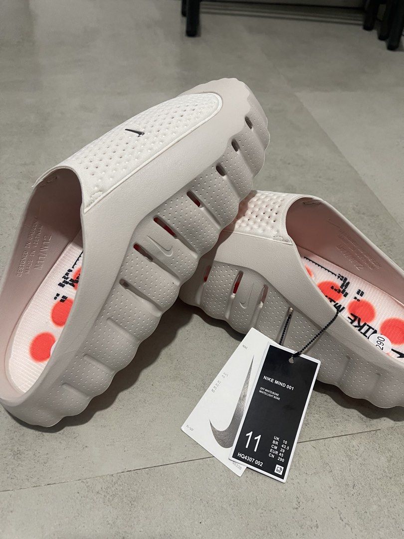 Nike Mind 001 Off White/White/Light Bone Sandals (Category: Slippers & Slides) located in Quezon City. Submitted by bentot24 (Listing ID 1440870200, Image 2). Description: - Nike Mind 001 Sandals - Color: Off White/White/Light Bone - Size: 11 US Men's - Style: Slip-on clogs - Features: Perforated design, cushioned sole with orange grip pods - Ideal for: Casual wear, post-workout recovery - Condition: Brand new with original tags.