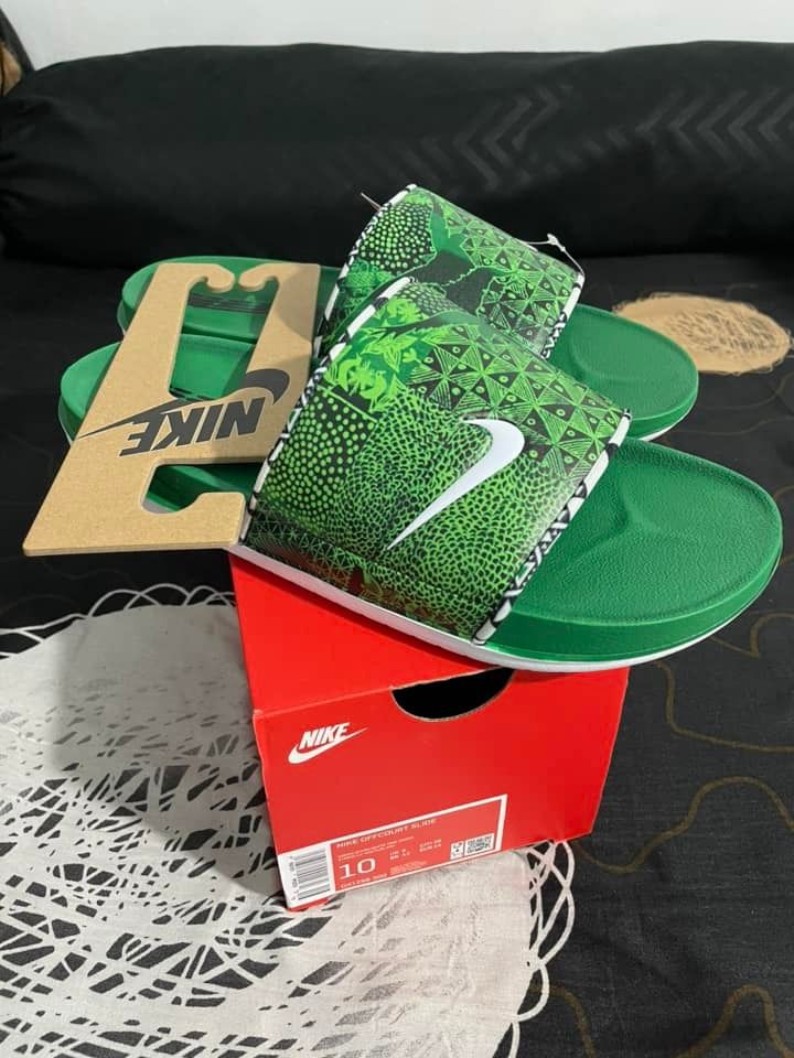 Nike Offcourt Slide - Green (Category: Slippers & Slides) located in Paranaque City. Submitted by camsysassy0696 (Listing ID 1440844731, Image 2). Description: FOR SALE! Brand new! BOX Size - US 10 | UK 9 | EUR 44 | CM 28 - Green Nike slides - Size 10 - Features a cool graphic pattern on the strap - Includes original box and tags - Ideal for casual wear or after sports Free Delivery within 5km 😉.