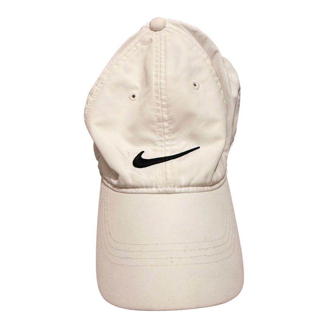 Nike White Sport Baseball Cap Adjustable Strapback Unisex Essential (Category: Caps & Hats) located in Paranaque City. Submitted by thepopneverstops (Listing ID 1440920604, Image 2). Description: Condition Rating: 8/10. This cap is in good condition, showing gentle signs of everyday use. It has been well-maintained and remains clean with no significant flaws to note. The fabric is durable and lightweight, making it perfect for daily wear or athle