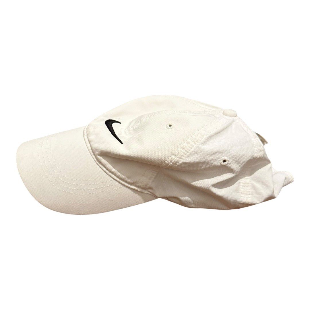 Nike White Sport Baseball Cap Adjustable Strapback Unisex Essential (Category: Caps & Hats) located in Paranaque City. Submitted by thepopneverstops (Listing ID 1440920604, Image 3). Description: Condition Rating: 8/10. This cap is in good condition, showing gentle signs of everyday use. It has been well-maintained and remains clean with no significant flaws to note. The fabric is durable and lightweight, making it perfect for daily wear or athle
