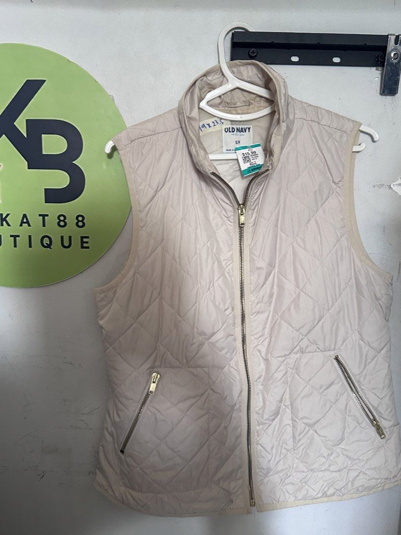 Old Navy Quilted Vest - Beige - Size S (Category: Coats, Jackets and Outerwear) located in Taguig. Submitted by kitkat88boutique (Listing ID 1440805423, Image 1). Description: - Lightweight quilted vest from Old Navy - Beige color, ideal for layering - Zipper front closure - Two zippered pockets - Perfect for cooler weather - Easy to pack and wear.