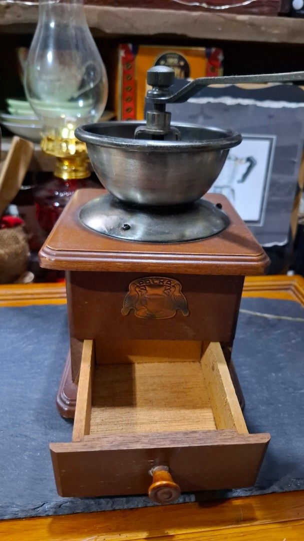 Palka Coffee Grinder (vintage) (Category: Coffee & Tea Tableware) located in Valenzuela. Submitted by shikkufindsmla (Listing ID 1440896001, Image 2). Description: - Dimensions : H:22cm W:12cm L:12cm -WYSIWYG -As is Where is - Vintage Palka coffee grinder - Classic wooden body with metal accents - Features a manual hand crank for grinding - Includes a drawer for collected grounds - Adds a retro aesthetic to any kitchen - Unique collectible item. 