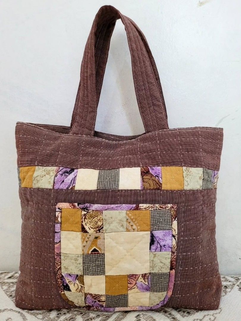 Patchwork Quilt Bundle Set (Category: Tote Bags) located in Balanga. Submitted by marae_c (Listing ID 1440948003, Image 2). Description: In verg good condition. Has few minimal storage stains as seen sa pics. Still very pretty and very useable. May front pouch pocket yung handbag, velco closure.. Makapal and sturdy handy bag for your everyday. Perfect for cottagecore whimsy fits. Measuremnts Handbag: length: 13 2" / height:11" (excluding handle s