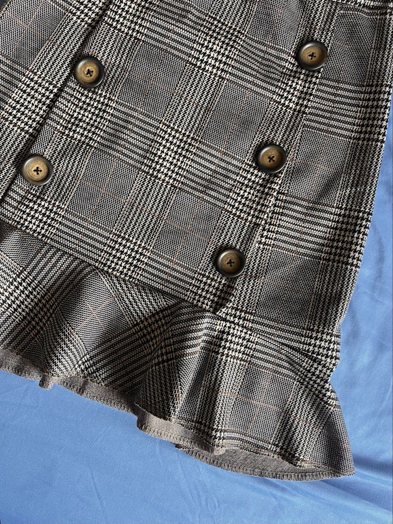 Plaid Ruffle Hem Skirt with Button Detail (Category: Skirts) located in Paranaque City. Submitted by ryanbyt (Listing ID 1440925146, Image 3). Description: Brown Plaid Ruffle Hem Skirt with Button Detail - 10/10 excellent condition Waist: 26-28 Length: 20 Message for inquiries.