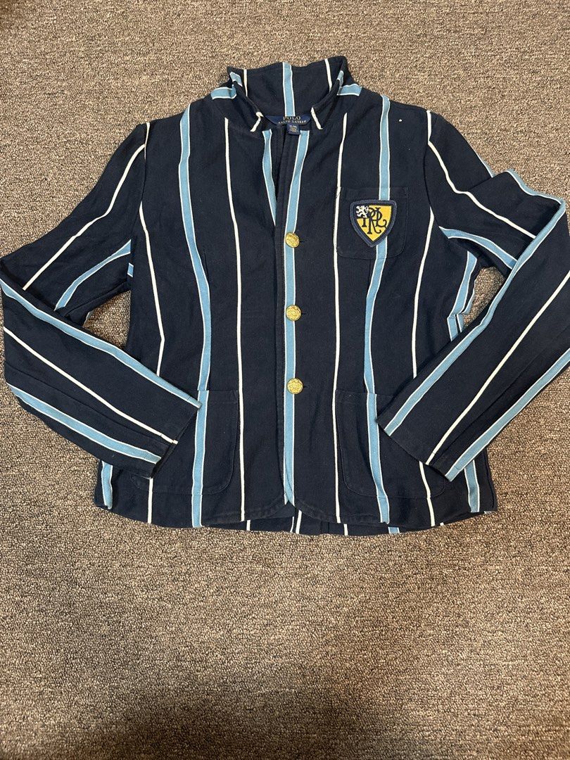 Polo Ralph Lauren Striped Blazer with Crest (Category: Coats, Jackets and Outerwear) located in Mandaluyong City. Submitted by krstls (Listing ID 1440821395, Image 1). Description: - Navy blue Polo Ralph Lauren blazer - White and light blue stripe detailing - Crest embroidered on the left chest - Gold button accents - Ideal for a smart casual outfit.