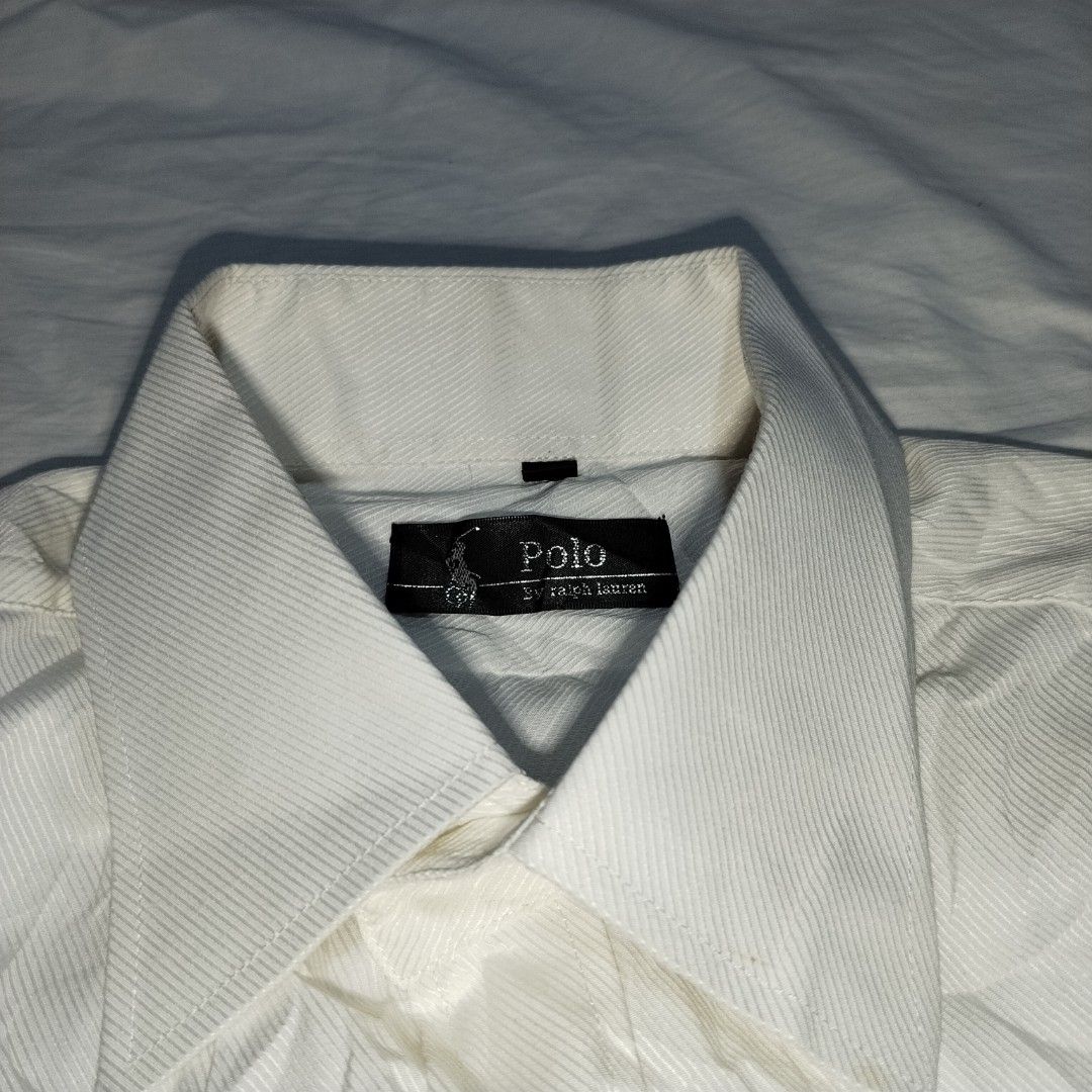 Polo Ralph Lauren White Button Down Shirt Size 41 (Category: Tshirts & Polo Shirts ) located in Manila. Submitted by nogiistuffs333 (Listing ID 1440882924, Image 3). Description: - Brand: Polo Ralph Lauren (Off) - Color: White - Style: Button-down shirt - Size: 41 - Features: Classic polo player logo embroidery on chest, chest pocket, button cuffs - Occasion: Suitable for smart casual or formal wear - Reason for Selling: No longer needed.