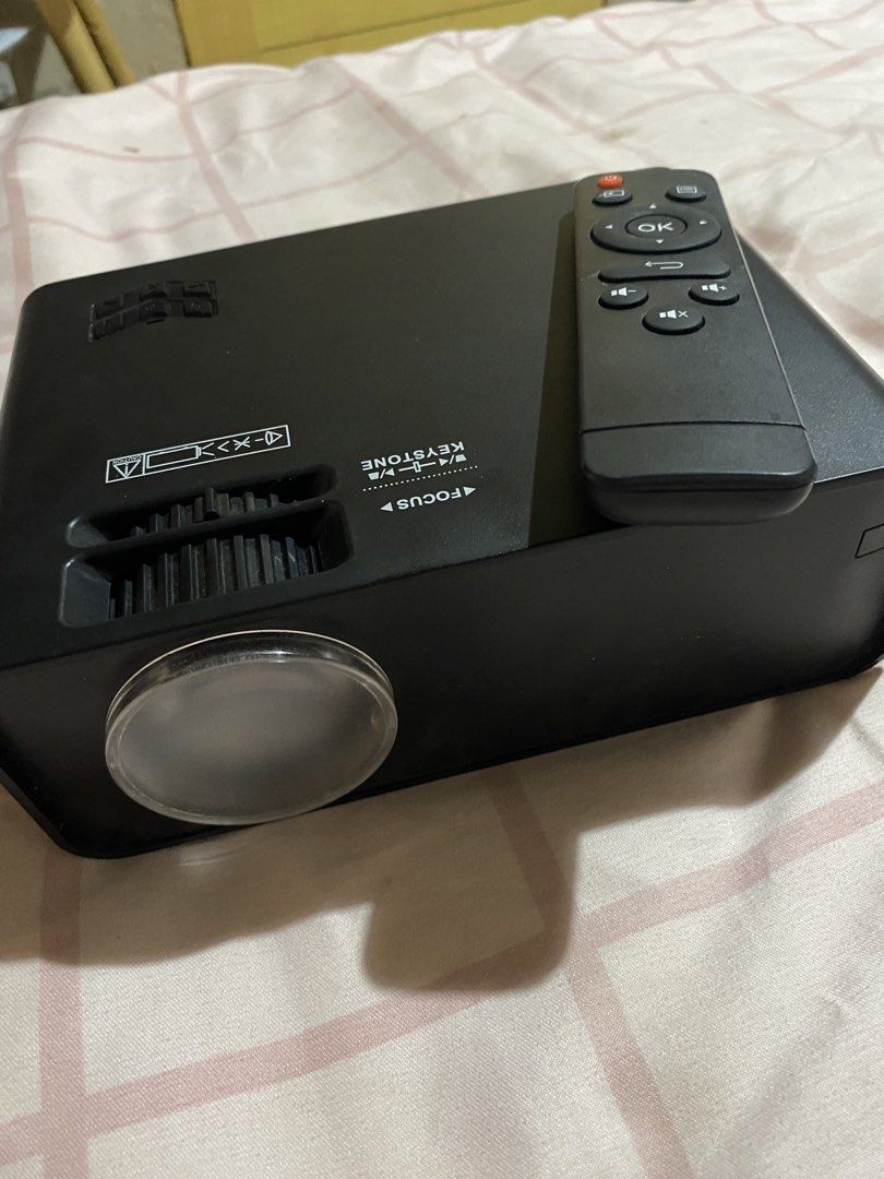 Portable Android Projector with Remote (Category: Projectors) located in Muntinlupa City. Submitted by leena3062 (Listing ID 1440854395, Image 2). Description: I already have a new projector hence selling this one :) Can connect to youtube, netflix and other apps without being connected to a laptop, ipad or phone. Can do mirrorcast too .