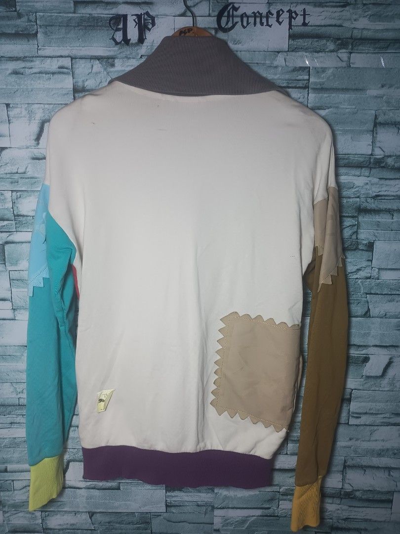 Puma x Michael Lau Patchwork Track Jacket (Category: Coats, Jackets and Outerwear) located in Quezon City. Submitted by apconcept22 (Listing ID 1440831218, Image 2). Description: - Unique patchwork design with multiple colors and textures - Full zip front closure - Comfortable collar - Perfect for casual wear.
