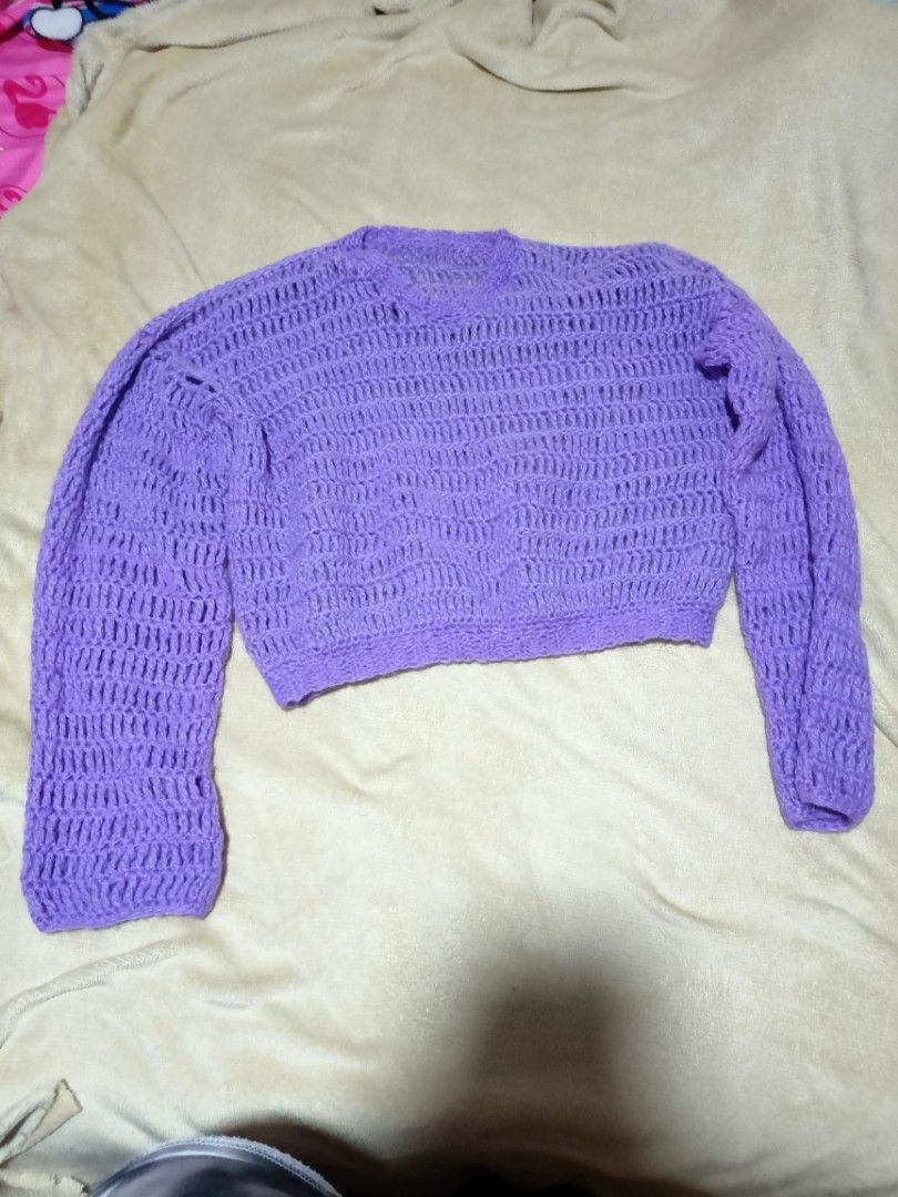 Purple Crochet Knit Cropped Sweater (Category: Longsleeves) located in Rizal. Submitted by declutterprod (Listing ID 1440803236, Image 2). Description: - Adorable purple crochet sweater - Handmade look and feel - Long sleeves with unique bell sleeve detail - Trendy cropped length - Versatile for layering or standalone wear - Truly a one-of-a-kind piece.
