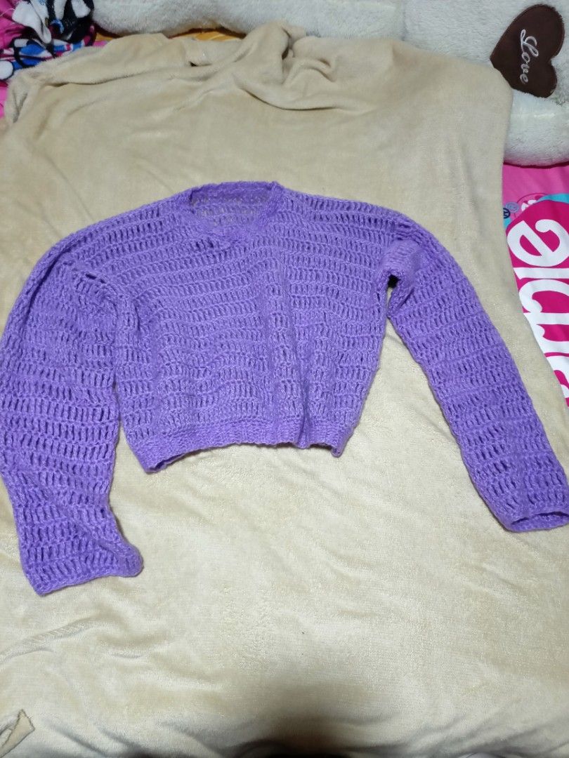 Purple Crochet Knit Cropped Sweater (Category: Longsleeves) located in Rizal. Submitted by declutterprod (Listing ID 1440803236, Image 3). Description: - Adorable purple crochet sweater - Handmade look and feel - Long sleeves with unique bell sleeve detail - Trendy cropped length - Versatile for layering or standalone wear - Truly a one-of-a-kind piece.