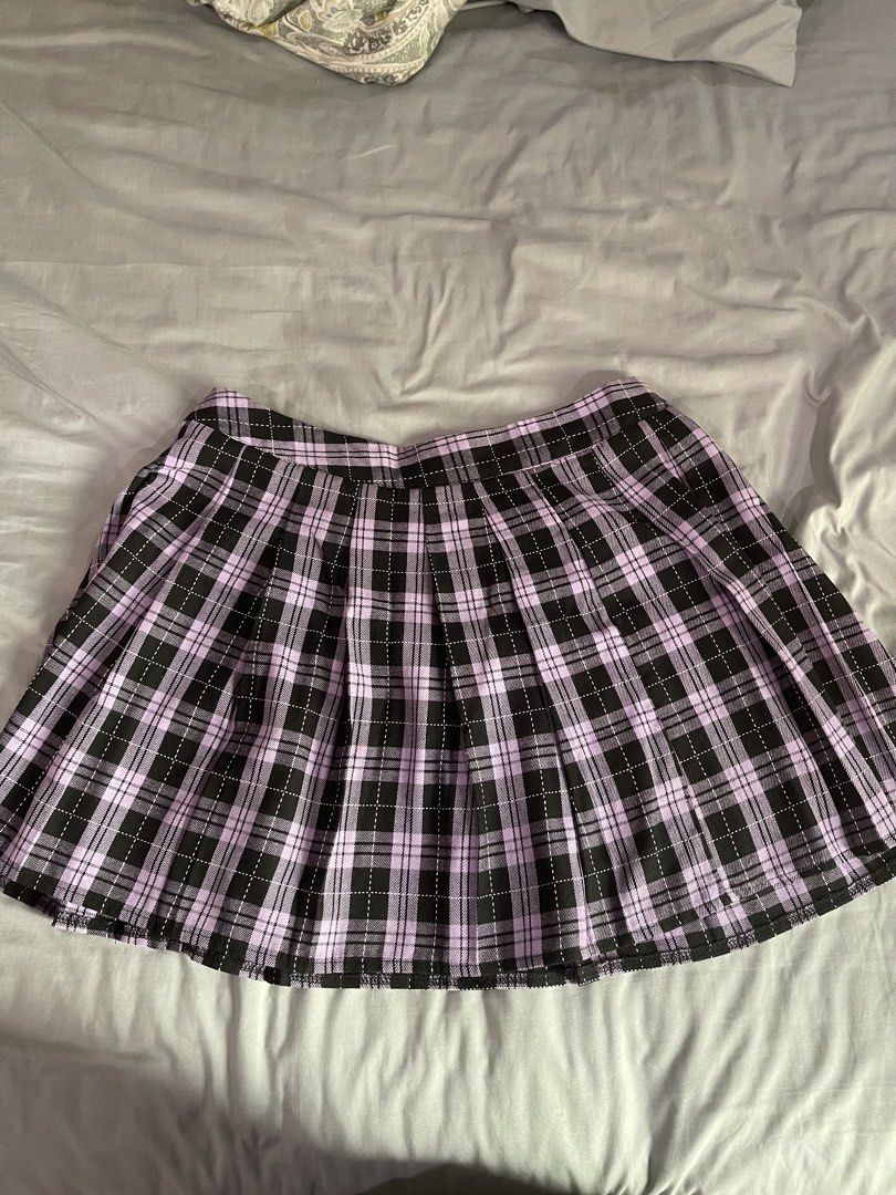 Purple Plaid Pleated Mini Skirt (Category: Skirts) located in Quezon City. Submitted by deahswardrobe (Listing ID 1440949648, Image 1). Description: - Cute purple and black plaid pleated mini skirt - Features a raw hem detail - Estimated size: Small to Medium - Ideal for Y2K or grunge aesthetic - Worn only once for a concert.