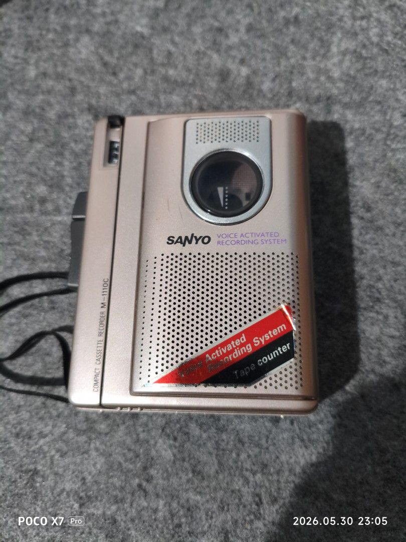 Sanyo M-110C Compact Cassette Voice Activated Recorder (Category: Portable Music Players) located in Baguio. Submitted by baguiobeans (Listing ID 1440915718, Image 1). Description: - Sanyo M-110C compact cassette recorder - Voice activated recording system - Features a tape counter - Powered by 3 AA batteries or 7V AC adapter - Ideal for recording notes or messages - Tested and confirmed working.