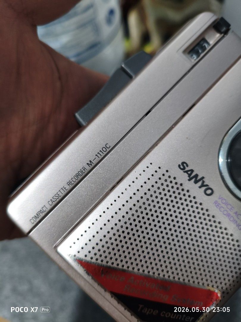 Sanyo M-110C Compact Cassette Voice Activated Recorder (Category: Portable Music Players) located in Baguio. Submitted by baguiobeans (Listing ID 1440915718, Image 2). Description: - Sanyo M-110C compact cassette recorder - Voice activated recording system - Features a tape counter - Powered by 3 AA batteries or 7V AC adapter - Ideal for recording notes or messages - Tested and confirmed working.